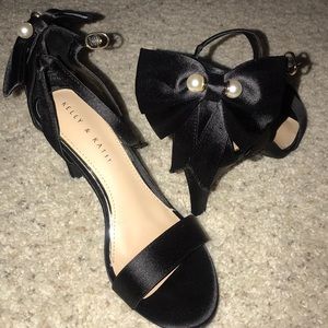 Black heels with bows on the back